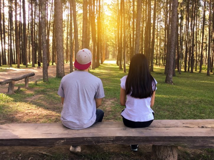 2 people under a tree